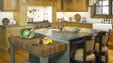 A view of this kitchen designed by Designer countertop, furniture, interior design, kitchen, room, table, wood, brown