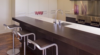 Two different cabinetry styles ensures this large, remodelled countertop, furniture, interior design, kitchen, product design, table, red, gray