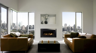A view of this apartment feauring and Escea fireplace, furniture, hearth, home, interior design, living room, room, gray