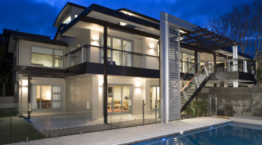 A view of a home by Santa Barbara apartment, architecture, building, elevation, estate, facade, family car, home, house, mixed use, property, real estate, residential area, swimming pool, villa, window, blue, gray