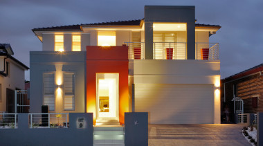 An exterior view of this home consturcted by architecture, building, elevation, estate, facade, home, house, official residence, property, real estate, residential area, siding, sky, window, blue