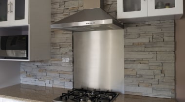 CraftStone has water-retardant elements built in at the countertop, flooring, home appliance, kitchen, kitchen appliance, kitchen stove, gray