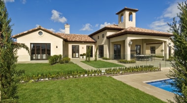 A view of a home designed by Masonry cottage, elevation, estate, facade, farmhouse, home, house, land lot, landscape, mansion, property, real estate, residential area, sky, villa, yard, brown