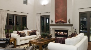 A view of a fireplace from Real Fires. ceiling, flooring, furniture, hardwood, home, interior design, living room, room, table, gray, brown