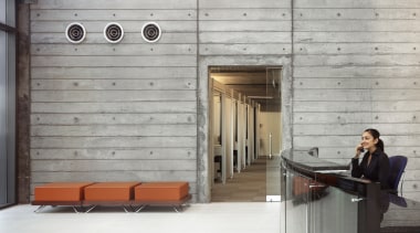 Rough-caste concrete, with pattenering to suggest the bored-formed architecture, floor, flooring, furniture, wood, gray