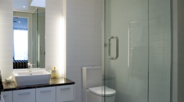 Simple, classic styling defines the apartment interiors. The architecture, bathroom, ceiling, daylighting, floor, glass, home, interior design, plumbing fixture, product design, room, gray