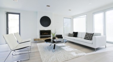 A view of this contemporary furniture from Interior coffee table, floor, furniture, home, interior design, living room, property, real estate, room, table, white