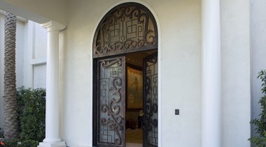 A view of the custome designed doors in arch, column, door, estate, facade, structure, window, white, gray