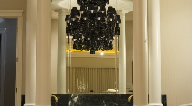 The owners apperciation of quality and craftmanship made ceiling, floor, flooring, furniture, hardwood, interior design, lobby, table, wall, orange, brown