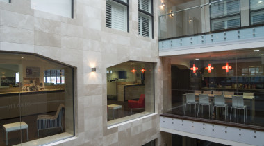 The solidity of the heards building ois expressed gray, black