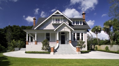 An exterior view of the entrance way to building, cottage, elevation, estate, facade, farmhouse, historic house, home, house, mansion, property, real estate, residential area, siding, sky, villa, blue