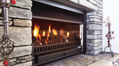 A view of a fireplace from Real Fires. fire screen, fireplace, hearth, heat, wood burning stove, gray, black