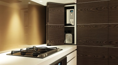 View of kitchen designed by Nicholas Murray featuring cabinetry, countertop, interior design, kitchen, room, brown, orange