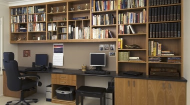 A view of a storage space by Creative bookcase, cabinetry, desk, furniture, institution, library, library science, office, public library, shelf, shelving, brown, black, gray
