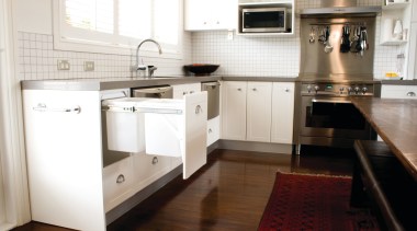 View of hideaway bin. - View of hideaway cabinetry, countertop, cuisine classique, floor, flooring, hardwood, home appliance, interior design, kitchen, kitchen appliance, kitchen stove, laminate flooring, room, wood flooring, white