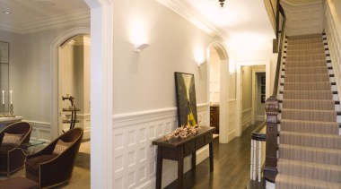 view of stairway featuring white walls, carpeted stairs, ceiling, estate, flooring, interior design, lobby, property, real estate, room, suite, brown, white, orange