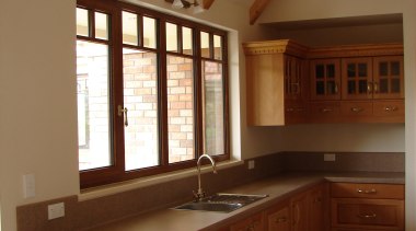 View of cabinetry by Classwood doors - View cabinetry, ceiling, countertop, cuisine classique, daylighting, floor, flooring, hardwood, home, interior design, kitchen, real estate, room, under cabinet lighting, window, wood, wood flooring, wood stain, brown