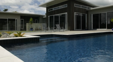 view of pool by Pool Resources. - view architecture, cloud, estate, home, house, property, real estate, reflection, sky, swimming pool, water, white