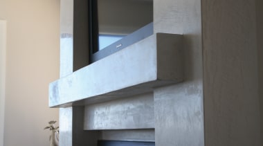 Side view of marblestone pre-cloured wall with t.v daylighting, room, shelf, shelving, wall, gray, black