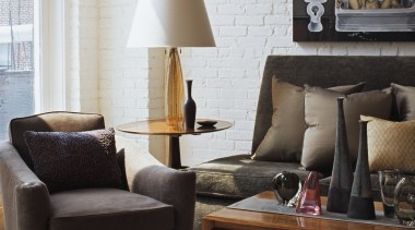 View of a living area in this apartment chair, coffee table, couch, furniture, home, interior design, lamp, lighting accessory, living room, loveseat, product design, room, table, black, gray