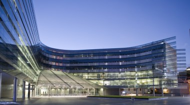 View of the exterior of the Owen G architecture, building, city, commercial building, condominium, convention center, corporate headquarters, daytime, headquarters, landmark, metropolis, metropolitan area, mixed use, reflection, sky, structure, blue