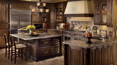 view of kitchen featuring tiled floor, wooden cabinetry, cabinetry, countertop, cuisine classique, flooring, hardwood, interior design, kitchen, room, wood flooring, brown