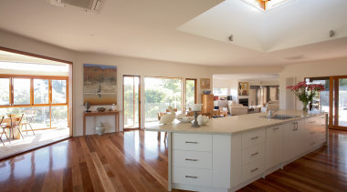 Generous open-plan living spaces and natural wood floors ceiling, daylighting, estate, floor, flooring, hardwood, home, house, interior design, kitchen, property, real estate, room, window, wood, wood flooring, gray, brown