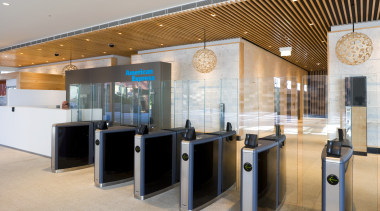 Security is tight, yet toughened-glass barriers lessen the interior design, lobby, gray