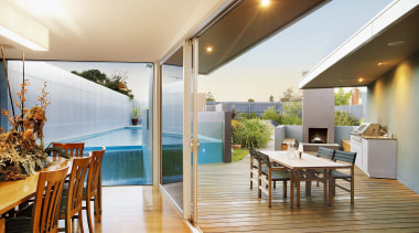 The house interlooks with a wedge-shaped pool, outdoor apartment, house, interior design, real estate, white