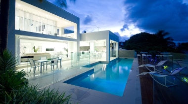 Bifold doors open to outdoor dining area and apartment, architecture, condominium, daylighting, estate, home, house, interior design, lighting, property, real estate, reflection, sky, swimming pool, villa, water, blue