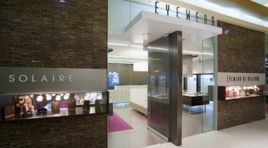 Image of Eyewear shop featuring cladding, cabinetry, tiled interior design, lobby, gray, brown