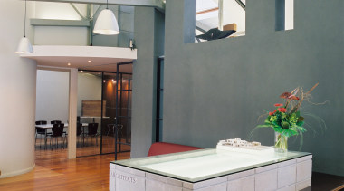 Materials are natural and understated, with clear finishes. architecture, countertop, daylighting, floor, interior design, loft, real estate, table, gray