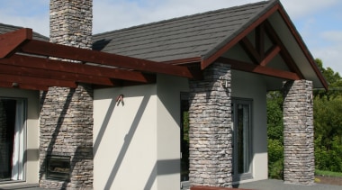 close up of house stutex stone chimney &amp; building, cottage, facade, farmhouse, home, house, property, real estate, roof, sky, wall, window, wood, gray
