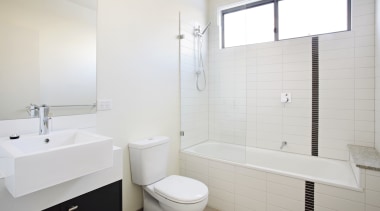 The contempoary design ogf the aprtments extends to bathroom, bathroom accessory, bathroom cabinet, bathroom sink, floor, interior design, plumbing fixture, product design, property, room, sink, tap, tile, wall, window, white