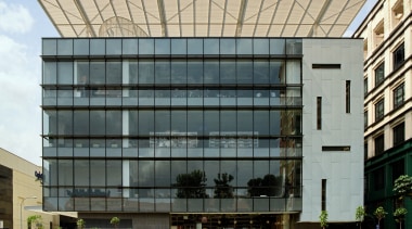 exterior view of the Bishan community Library featuring apartment, architecture, building, commercial building, condominium, corporate headquarters, facade, headquarters, house, mixed use, real estate, residential area, gray