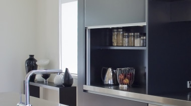 Designer Robyn Labb used a simple material palette countertop, floor, furniture, interior design, kitchen, product design, shelf, shelving, gray