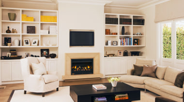 This newly renovated Herne Bay home features a furniture, hearth, home, interior design, living room, room, shelving, white, orange