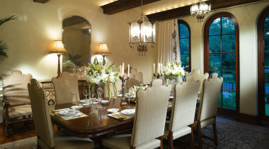 View of the dining room which features chandeliers, ceiling, dining room, function hall, home, interior design, restaurant, room, table, brown