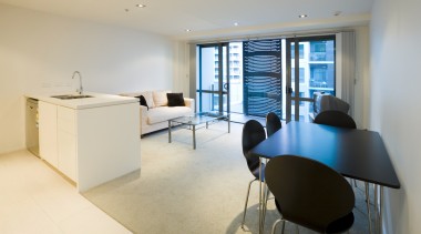 The Docks consists of four seperate apartments towers, apartment, floor, interior design, office, property, real estate, room, table, orange, gray