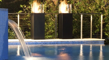 View of new EcoSmart Fire Tower from Real blue, evening, landscape lighting, leisure, light, lighting, reflection, sky, swimming pool, tree, water, water feature, blue, brown