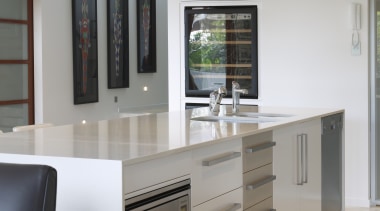 Kleenmaid's spacious microwave and energy-efficient dishwasher are intergrated cabinetry, countertop, floor, furniture, hardwood, home appliance, interior design, kitchen, room, shelving, gray