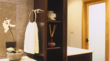 The tall column of decorative shelving has the bathroom, furniture, home, interior design, room, orange, black