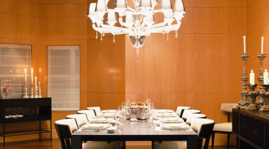 image of the main dining room which features ceiling, chandelier, dining room, furniture, interior design, light fixture, lighting, restaurant, room, table, wall, brown