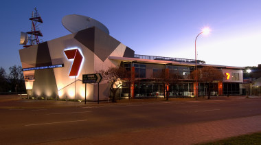 The Channel Seven studio and offices compenstae for architecture, building, city, downtown, dusk, evening, lighting, night, residential area, sky, structure, red, blue