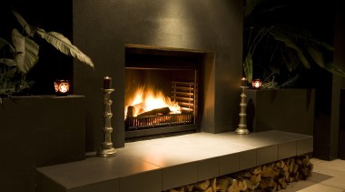 The Nouveau Outdoor Fire, available from Fires By fireplace, hearth, heat, brown, black