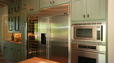 By the wine bar is a wine cooler. cabinetry, countertop, home appliance, interior design, kitchen, kitchen appliance, major appliance, room, brown