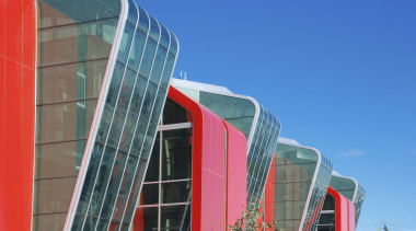 Image of curved glazing from on this fire architecture, blue, building, city, commercial building, corporate headquarters, daytime, facade, line, metropolis, metropolitan area, real estate, sky, skyscraper, structure, tower block, urban area, teal