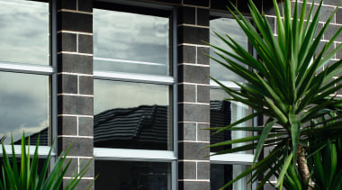 Brick has been used a building material or facade, house, window, black