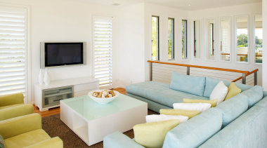 Internally, this two storey home is decorated with home, interior design, living room, property, real estate, room, white