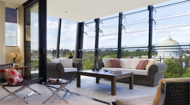 Interior view of the Lucient Apartments which features balcony, daylighting, house, interior design, living room, patio, penthouse apartment, property, real estate, window, gray, white